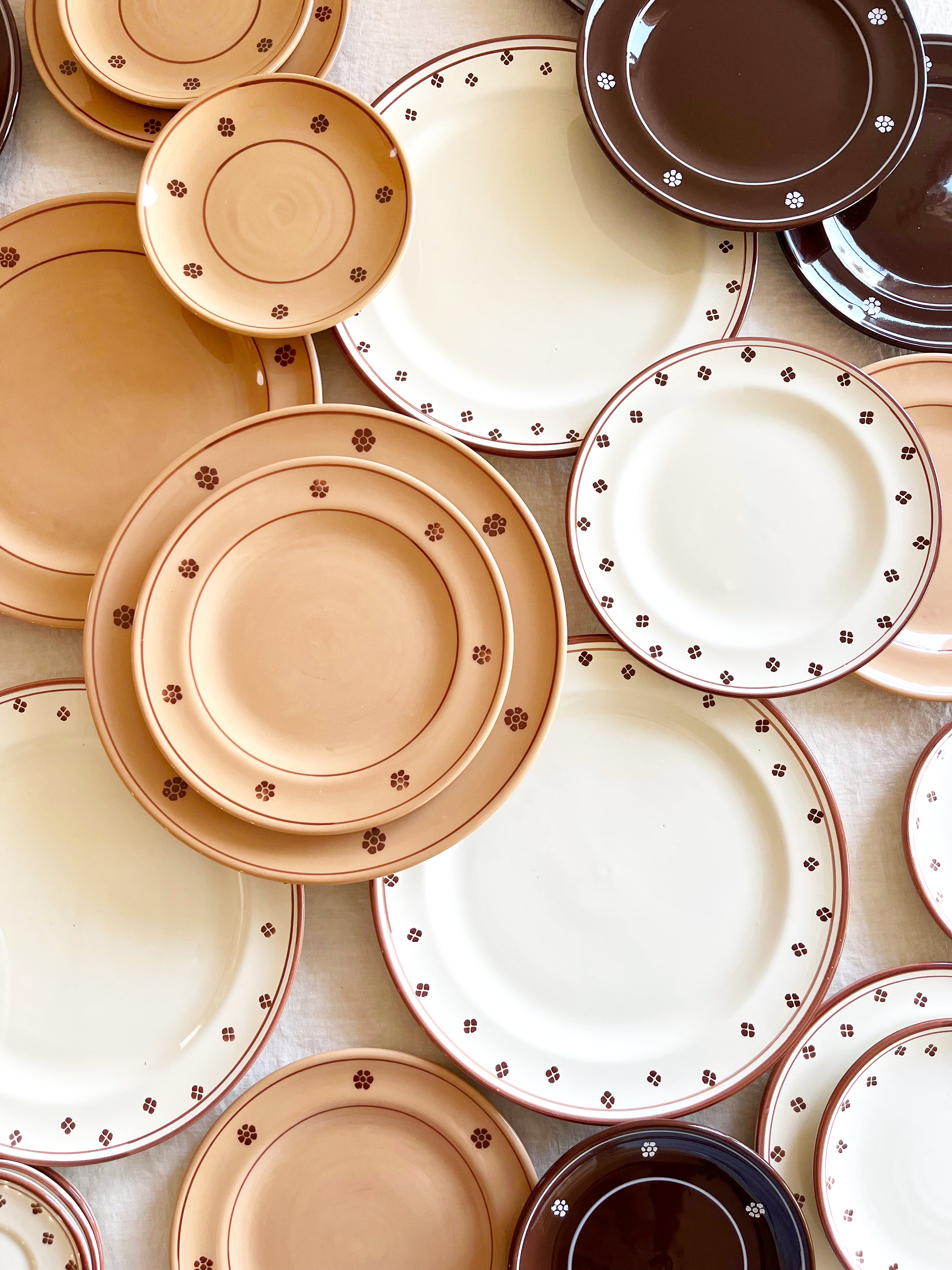 brown and white salad plate in group on table