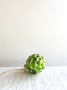 glass christmas ornament shaped like artichoke