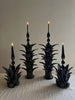green taper candle holder shaped like the top of a pineapple in group with other size options