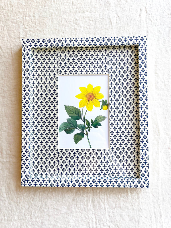 navy and white fleur de lys print paper wrapped frame and mat with yellow daisy botanical print 11" by 13"