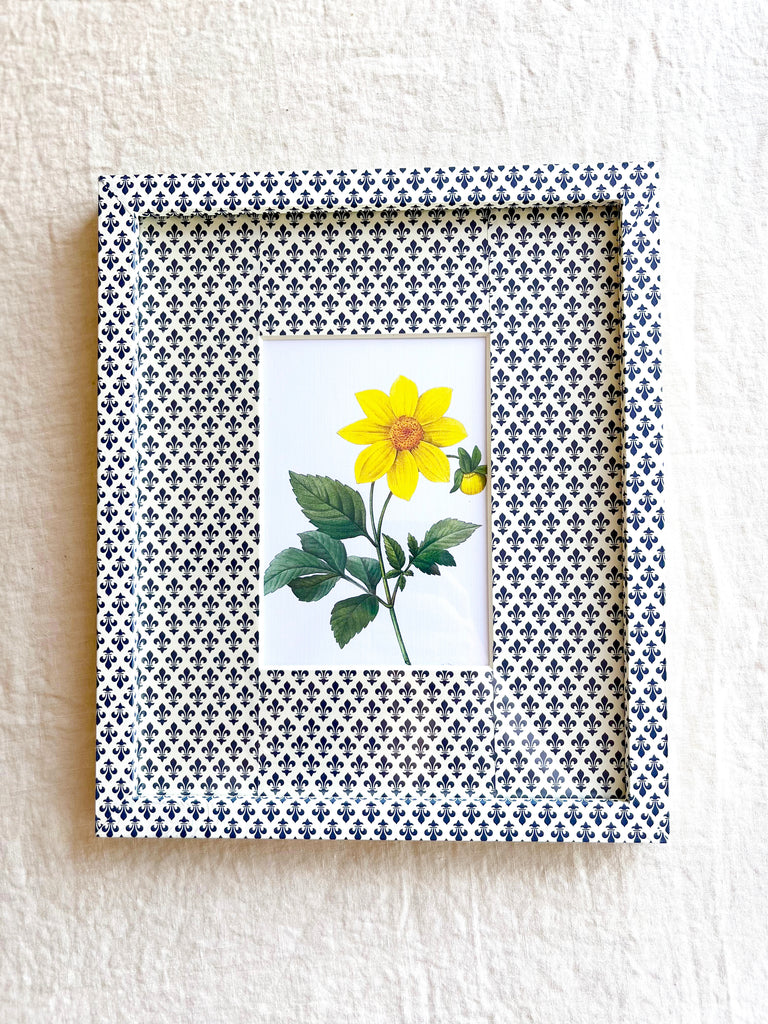 navy and white fleur de lys print paper wrapped frame and mat with yellow daisy botanical print 11" by 13"
