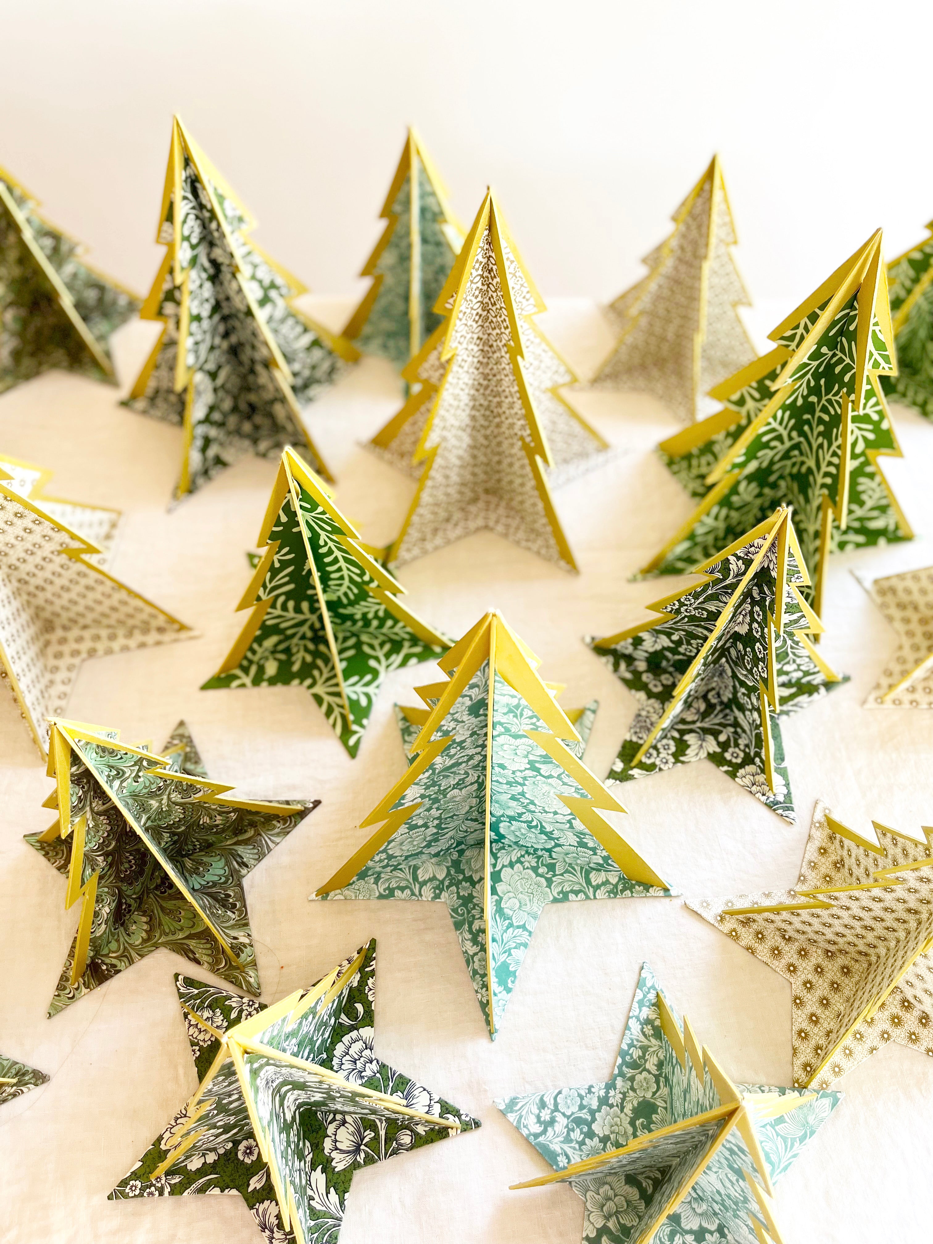 decorative paper christmas tree stands with green leaf pattern top view of group