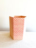 red and yellow poppy print paper wrapped octagonal waste basket