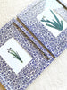 navy and white floral print paper wrapped frame and mat with blue botanical print 11" by 13" on white table