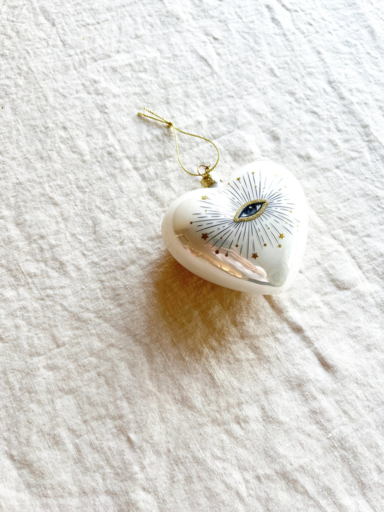 white heart with gold eye glass christmas ornament angled view
