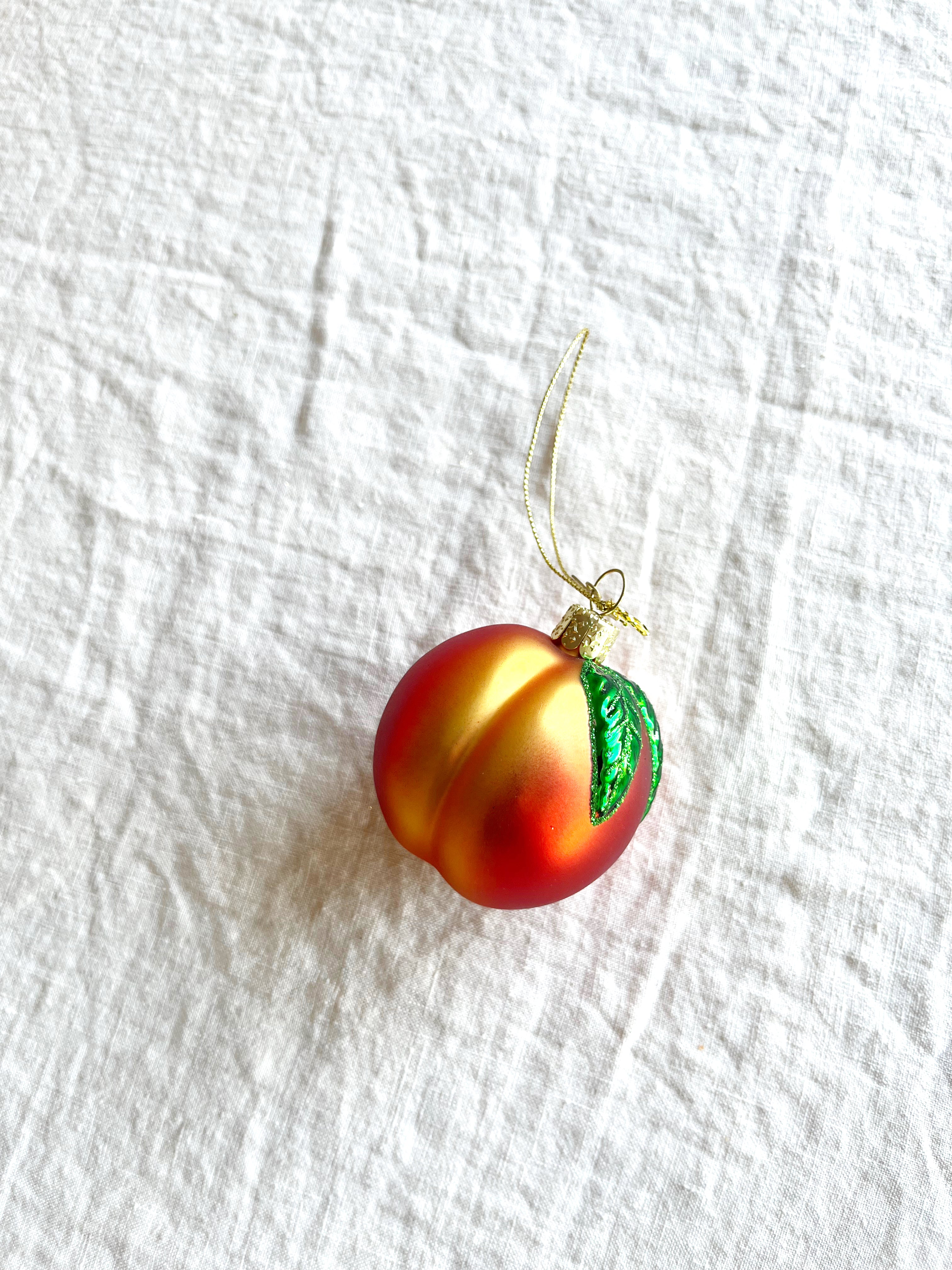 peach shaped glass christmas ornament detail view