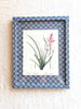 blue and white interlocking ring print paper wrapped frame and mat with pink floral botanical print 12" by 15" on white table