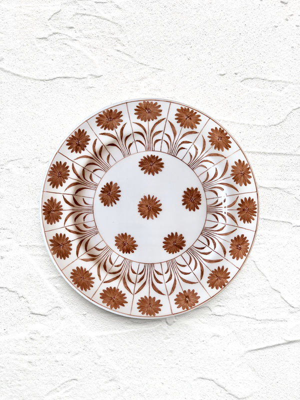 white ceramic salad plate with brown daisy pattern