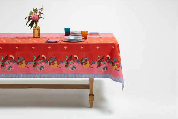 red rectangle cotten tablecloth with red and yellow roses on edge side view