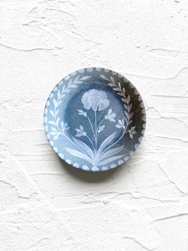 blue bread plate with white floral pattern