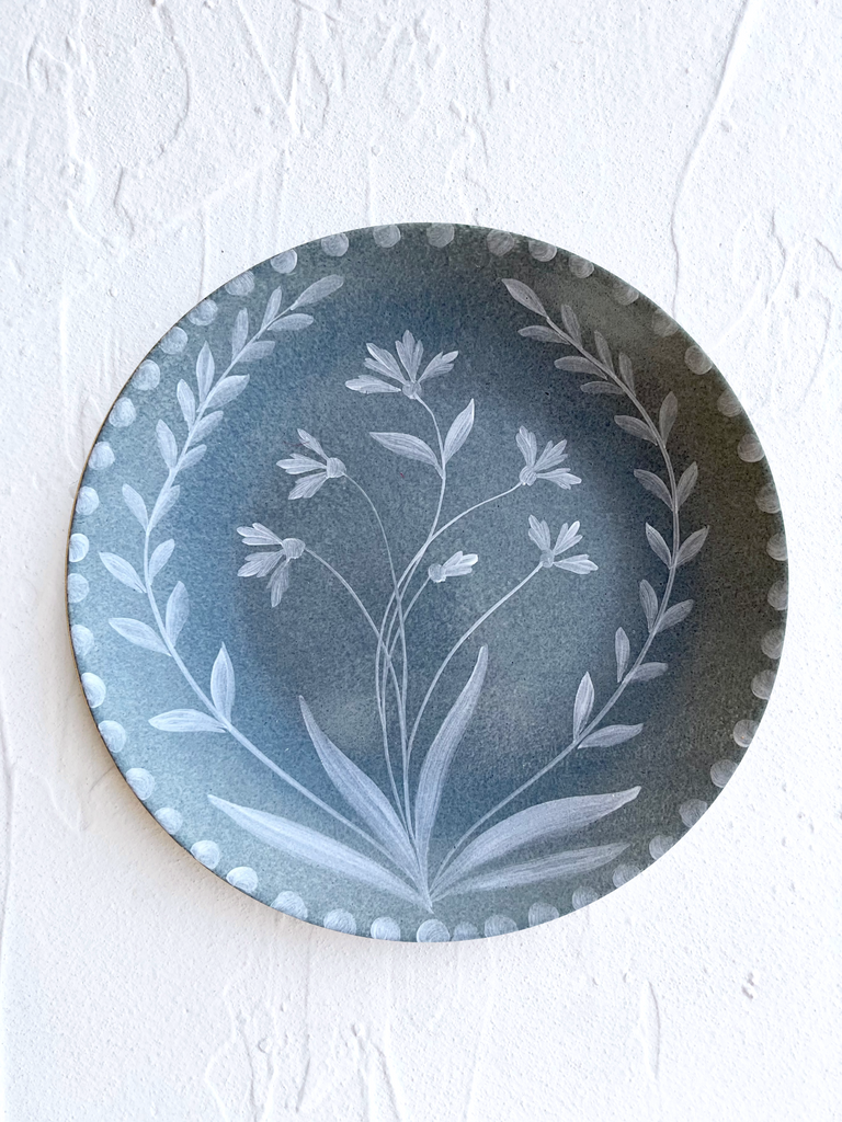 blue dinner plate with white floral pattern