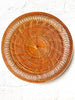 round placemat woven in tangerine color