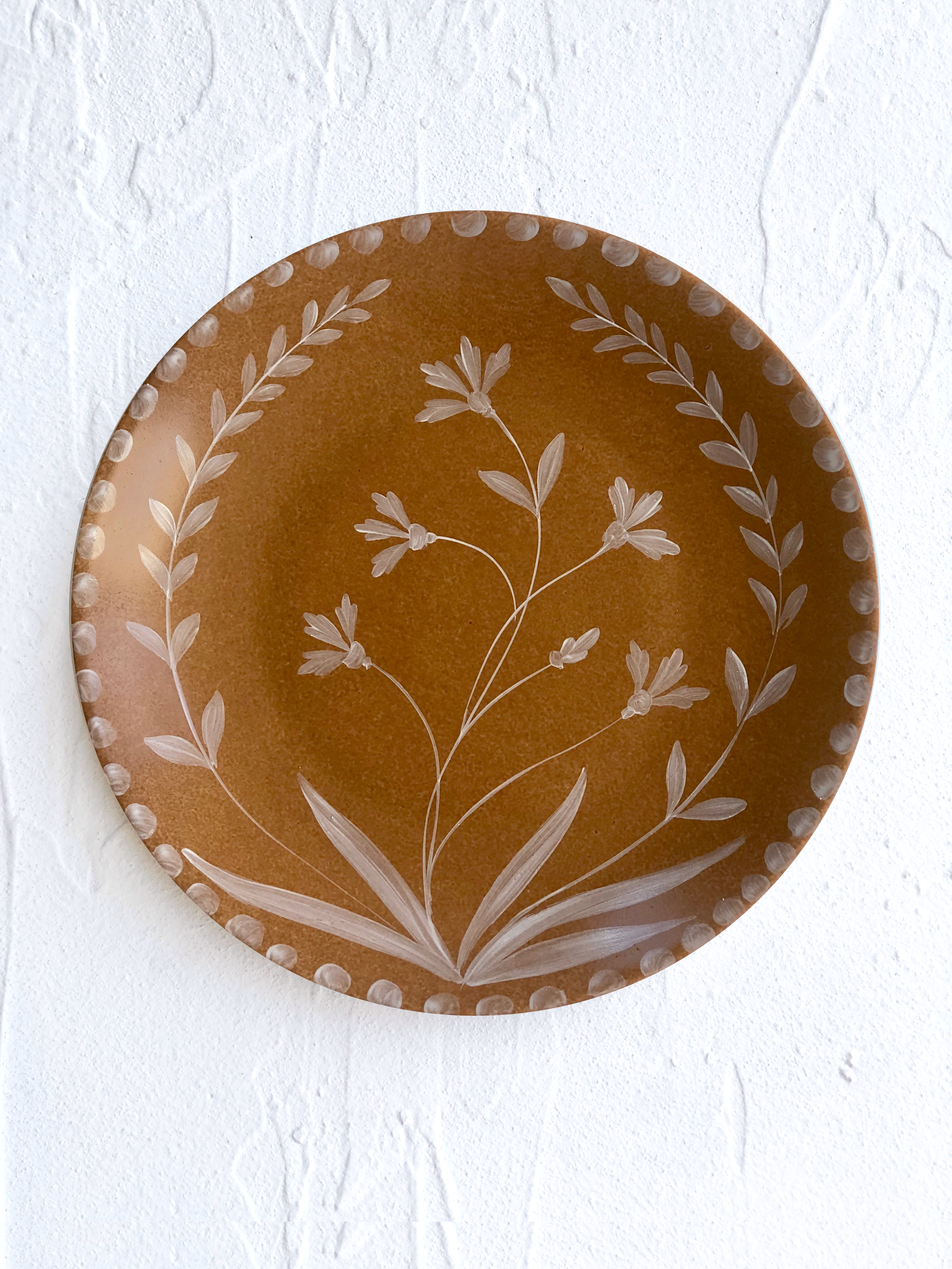 Umber toned brown dinner plate on table