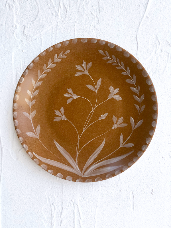 Umber toned brown dinner plate on table