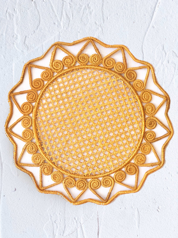 round yellow gold woven placemat 