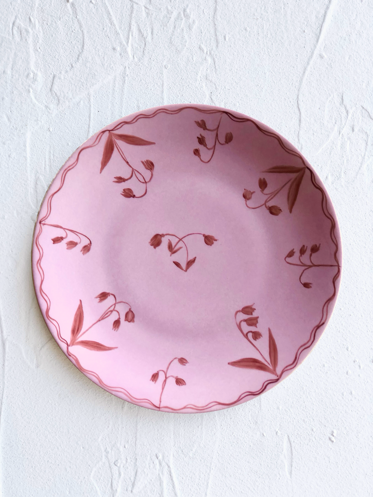 pink dinner plate with red floral design 10.5 inch