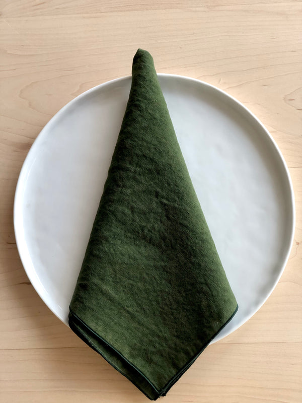 forest green rolled edge linen napkins with teal edge 18 inch square folded