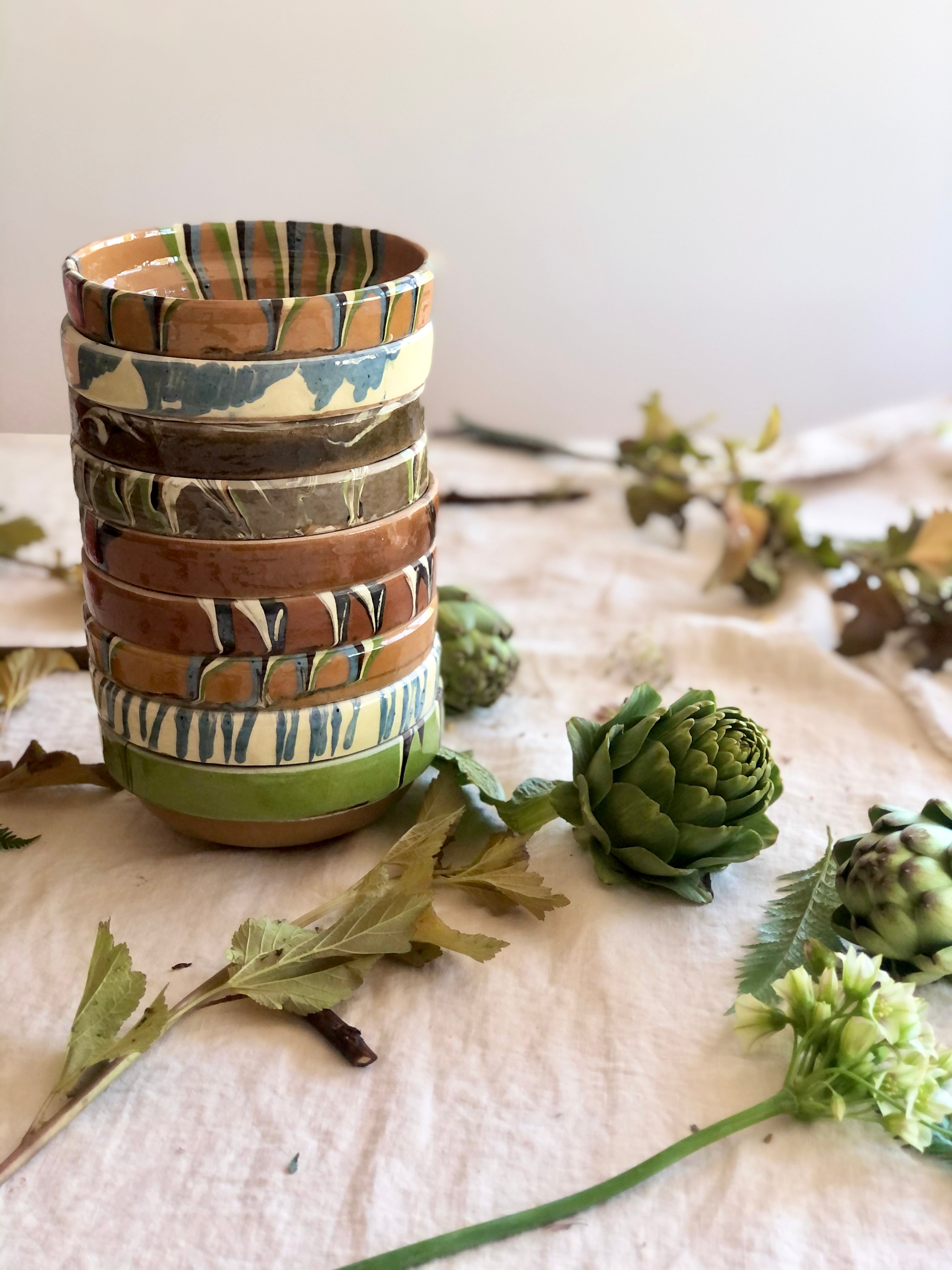 multicolor ceramic bowls group stacked together