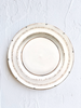 ceramic dinner plate with narrow brown brush strokes around rim