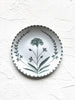 white salad plate with hand painted green floral design on white table