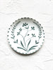 white salad plate with hand painted green floral design