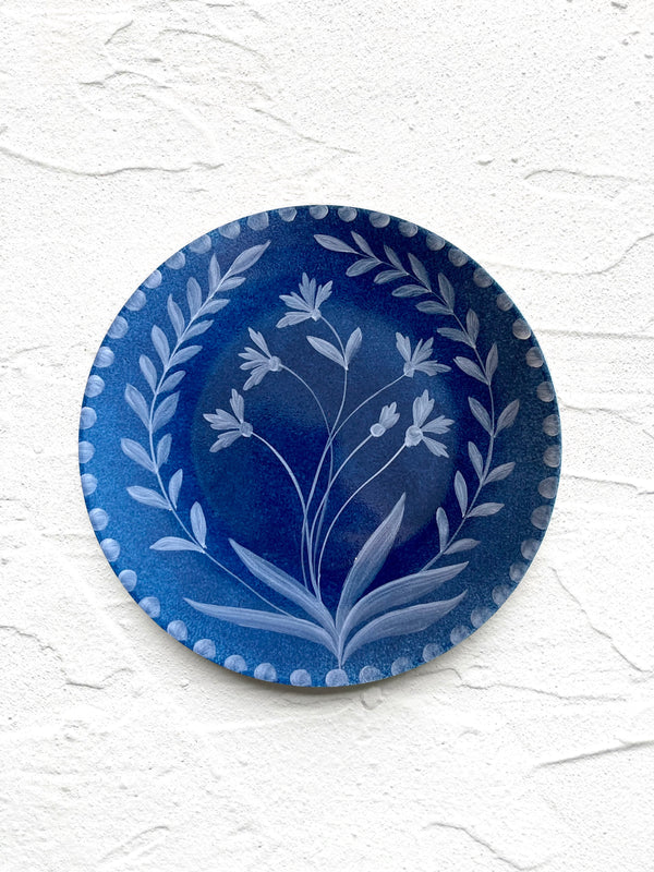 blue salad plate with hand painted white floral design
