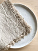 cream linen napkins with macrame trim detail view
