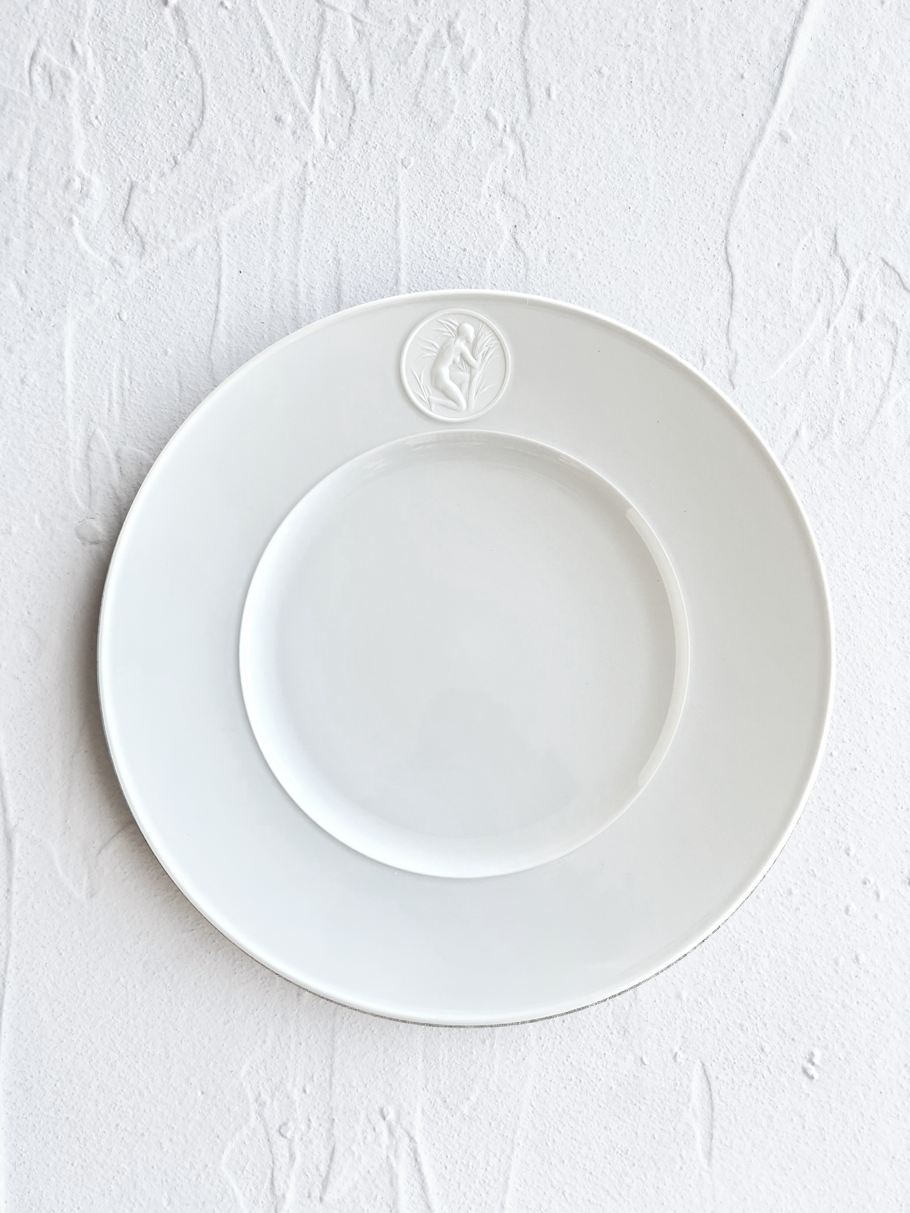 white dinner plate with greek medallion design