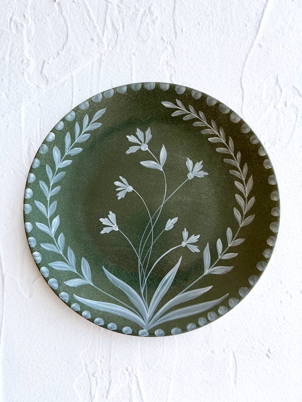dark green limoges porecelain dinner plate with hand painted white floral design