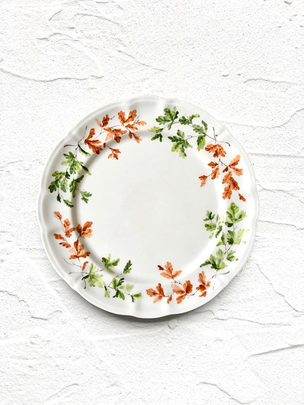 salad plate with green and orange leaves on rim