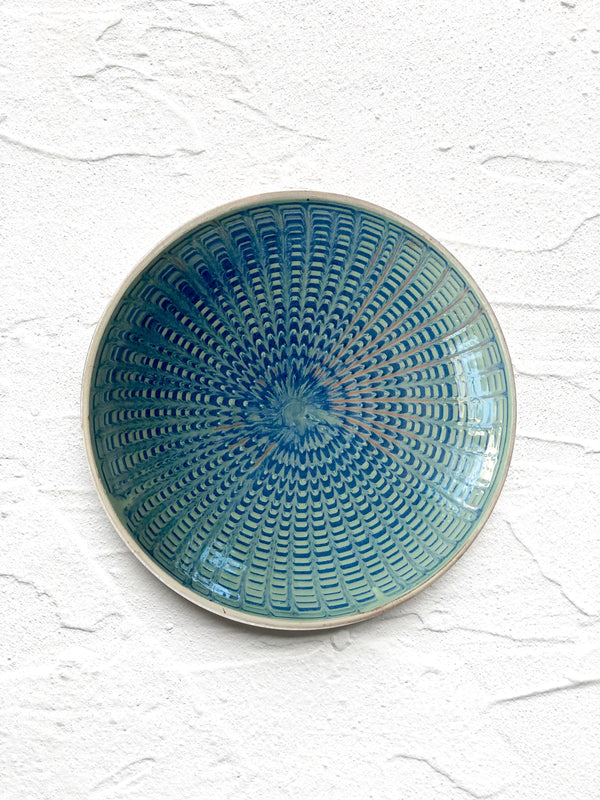 teal and green salad plate with radial peacock pattern 
