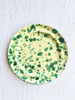 fasano dinner plate with green and cream splatter pattern