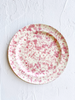 cream fasano dinner plate with pink speckle pattern