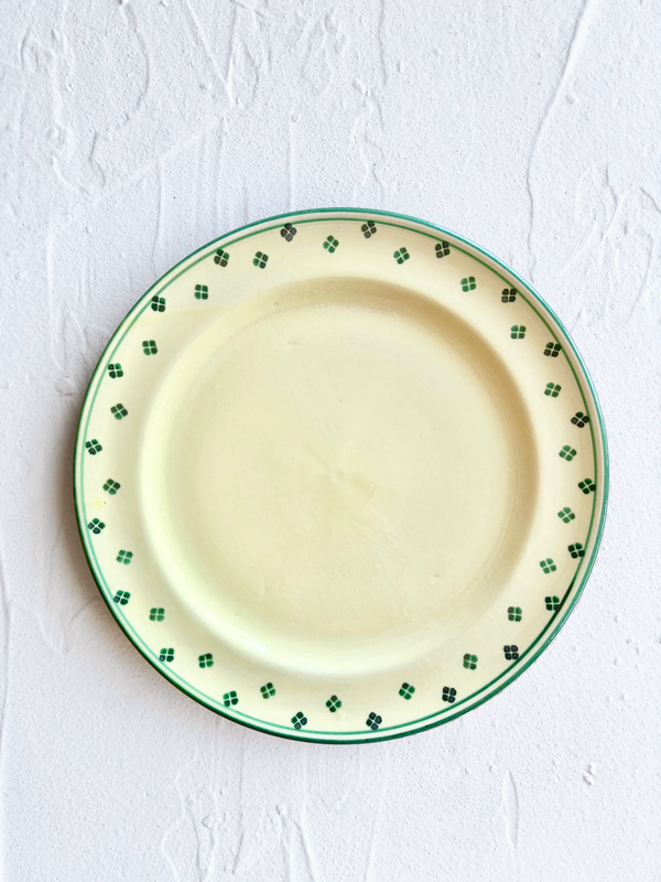hand painted dinner plate with green rim and dots around edge