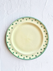 hand painted dinner plate with green rim and dots around edge