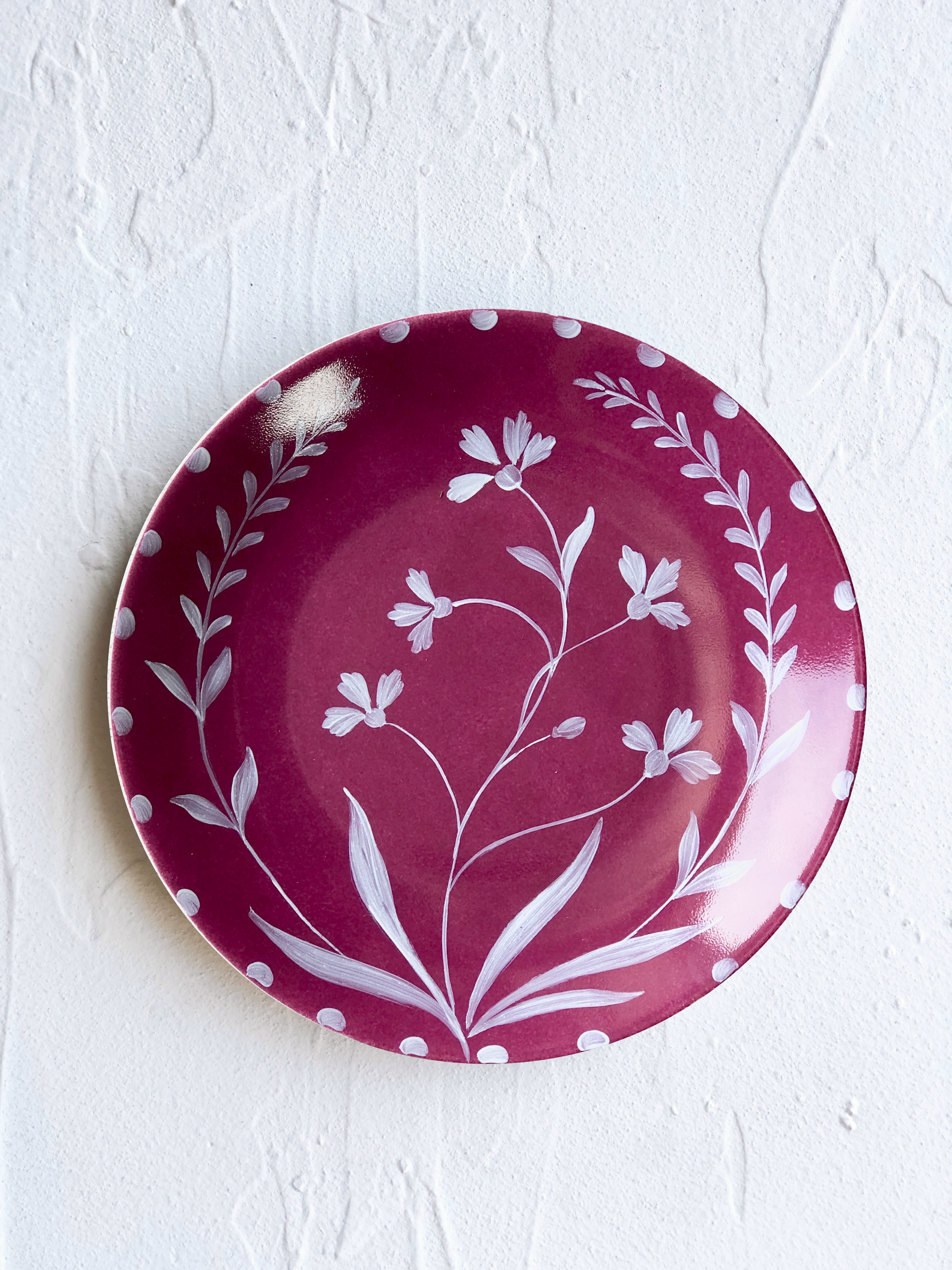 red limoges porecelain dinner plate with hand painted white floral design